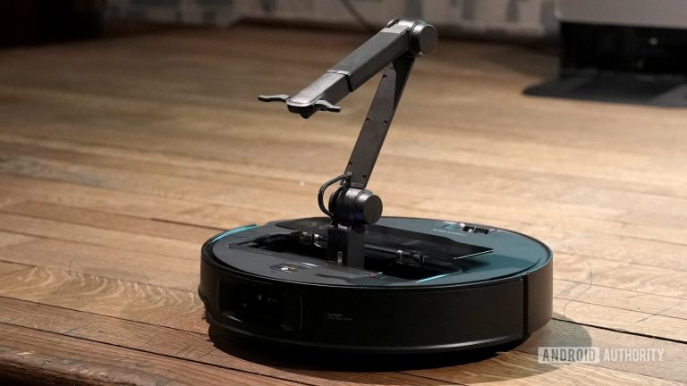 This robovac comes with a robo arm to move your socks out of its way